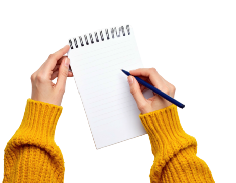 Person in a yellow sweater holds a lined notepad with a blue pen, ready to write