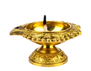 Ornate brass oil lamp with spent wick, intricate details, against black backdrop