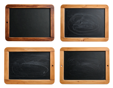 Four vintage chalkboards, some clean, some with chalk marks, with wooden frames