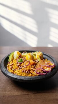 Vertical Video, Eto with Groundnut and Avocado, Mashed Ripe Plantain Mixed With Palm Oil, Onions, and roasted groundnuts, Africa Ghana Traditional Dish