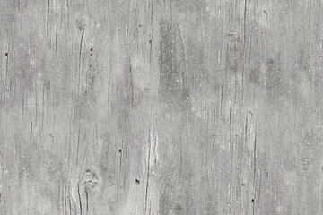 Obraz premium Texture of distressed, light gray wooden boards with visible grain and vertical cracks. This bright, rustic wood background is perfect for vintage, shabby chic design concepts.