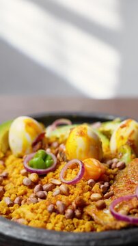Vertical Video, Eto with Groundnut and Avocado, Mashed Ripe Plantain Mixed With Palm Oil, Onions, and roasted groundnuts, Africa Ghana Traditional Dish