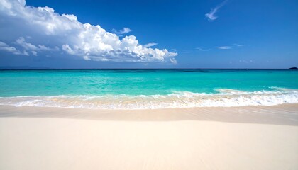 Wide shot of a white sandy beach, turquoise water, and blue sky with clouds