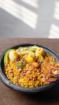 Vertical Video, Eto with Groundnut and Avocado, Mashed Ripe Plantain Mixed With Palm Oil, Onions, and roasted groundnuts, Africa Ghana Traditional Dish