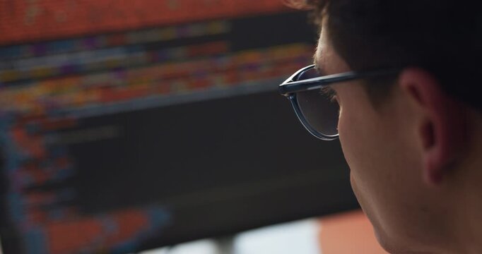 Programmer, reading and code with HTML on computer screen for software development, web design in office. Man, script review or app developer with frontend UI, algorithm or website for cybersecurity