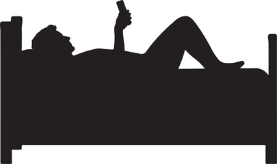 Silhouette of person lying in bed using smartphone