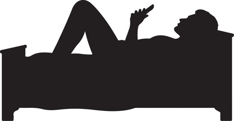Silhouette of person lying in bed using smartphone