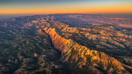 Aerial view of dramatic seismic fault line during sunrise