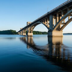 Obraz premium Bridge Over Still Water - A Serene Reflection of Architecture.