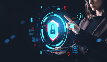 Woman interacting with digital cybersecurity hologram interface on futuristic screen concept.