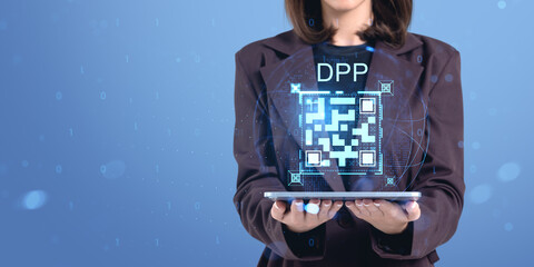 Woman holding tablet with digital QR code representing product p