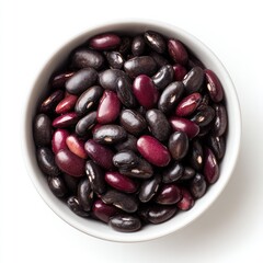A white bowl filled with a mix of black and dark red beans