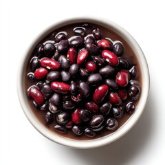 A white bowl filled with black and red beans, glossy and plump