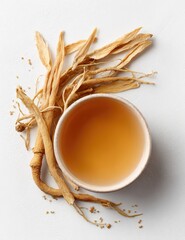 Dried ginseng roots and tea in a small bowl