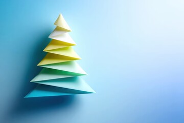 Obraz premium Colorful Paper Tree Model Against Blue Backdrop