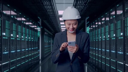 Front View of Asian Businesswoman Use Smartphone While Walking in Server Room Data Center - Powered by Adobe