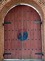 Traditional Korean wooden door decorated with Taegeuk patterns - Taegeuk symbol is typically associated with Korean traditions and represents balance in the universe