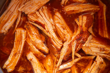 Authentic cochinita pibil recipe in a dish and tacos typical of the Yucatan Peninsula in Mexico.