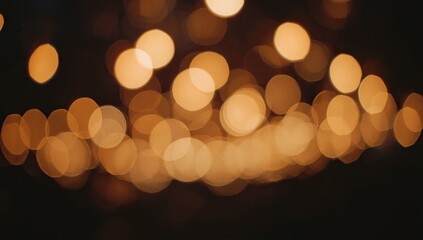 Fototapeta premium Elegant bokeh effect showcases soft, warm, and inviting golden-yellow circles of light floating gently against a dark backdrop, creating a dreamy and atmospheric visual.