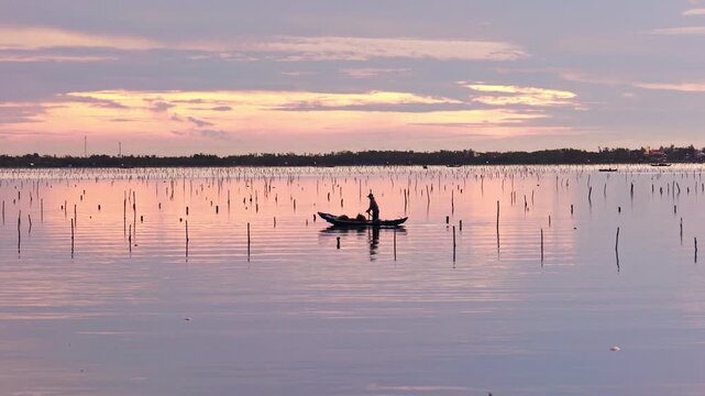 Lap An Lagoon in dawn sunrise is a brackish water lagoon located on the shore of Lang Co Bay. This is one of 12 typical lagoons of Central Vietnam.