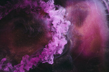 Fototapeta premium Abstract fluid art background. Moving flow of purple gold paints, dark space sky
