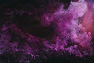 Abstract fluid art background. Moving flow of purple gold paints, dark space sky