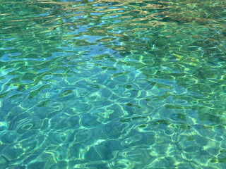Sea amazing clear emerald water surface.