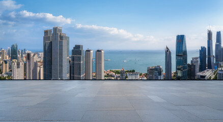Modern city skyline with tall buildings and sea view