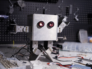 This robot is made by myself.Research robot on the workbench