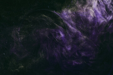 Abstract fluid art background. Moving flow of purple gold paints, dark space sky
