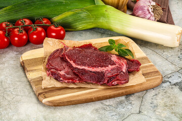 Raw beef cheeks cut for cooking