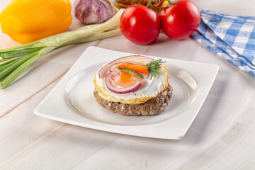 Beefsteak chop with roasted egg