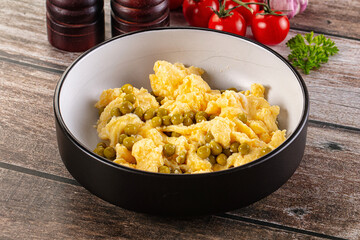 Scrambled egg omelet with green peas