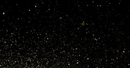 Detailed wave of airborne clay dust swirling in chaotic motion, captured in freeze  motion. Dramatic natural explosion of earthy particles on black background.