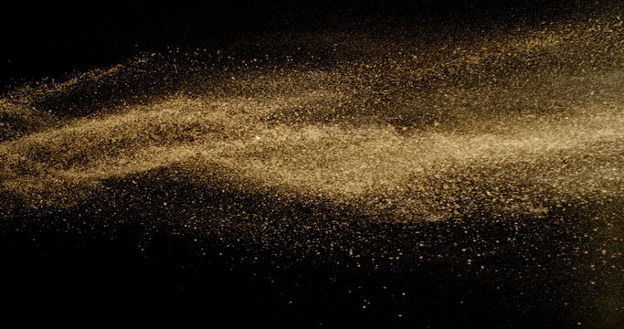 Fine beige cosmetic powder cloud suspended in air, isolated on black background. Elegant abstract motion concept captured in studio light. Makeup explosion and beauty design. - Powered by Adobe