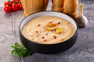 Tasty cheese cream soup with crouton