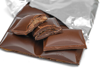 A broken bar of milk chocolate with toffee filling