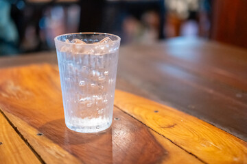 A glass of iced water on the table