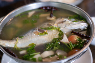 Mackerel tom yum, a spicy and sour Thai soup featuring mackerel, herbs, and aromatic spices.