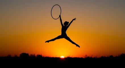 Silhouette of person jumping with hoop at sunset active lifestyle concept