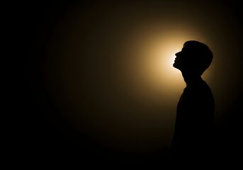 Seeking Light: A contemplative silhouette gazes upward towards a radiant light, conveying introspection, hope, and the quest for knowledge in a serene, enigmatic atmosphere.
