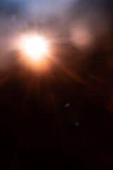 Blurred image Sun flare on the black background