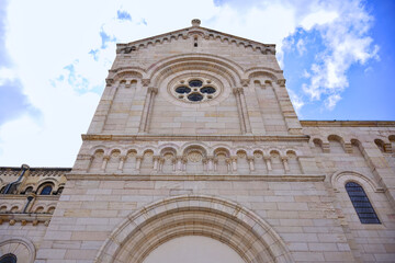 Gothic church architecture with rose window and cloudy sky