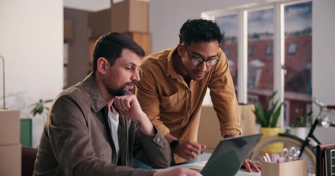 Shipping, small business and team with laptop for planning, inventory check and problem solving. Computer, office and men talk for distribution schedule, think and logistics of stock procurement