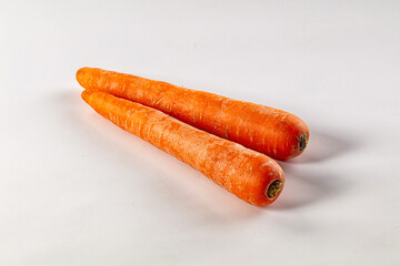 Young orange ripe carrot heap