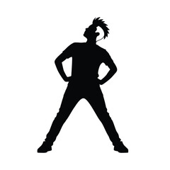 Silhouette of a man with a mohawk wearing a t shirt and jeans standing with hands on hips looking up