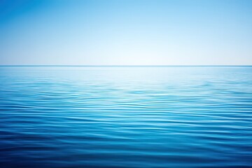 Obraz premium Expansive ocean horizon blending tranquil azure shades with subtle ripples creating a peaceful ambiance that captures the essence of calmness and serenity in a minimalist seascape