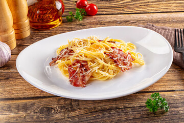 Italian classic spaghetti carbonara with bacon and egg