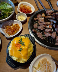 Grilled flavors meet comfort in vibrant feast.