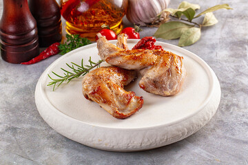 Roasted rabbit leg served rosemary